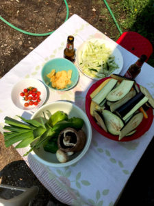 A table with raw veggies and snacks